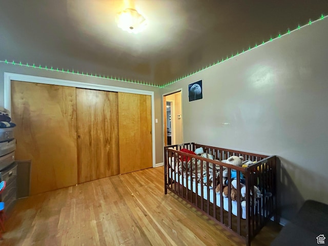 479 S Vernal Ave, Vernal, UT 84078 - bedroom featuring wood finished floors, a closet, and a nursery area