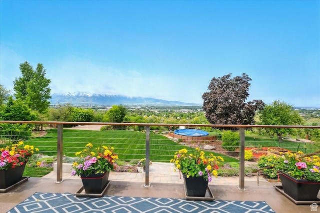 balcony featuring a mountain view