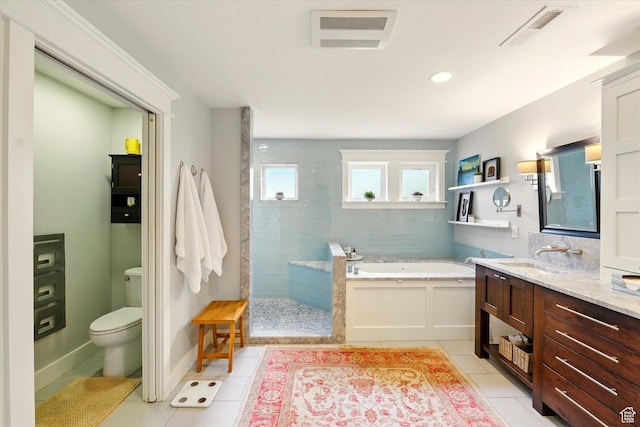 full bathroom featuring tile patterned floors, a bath, a walk in shower, toilet, and vanity