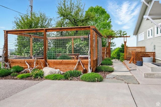 view of patio / terrace featuring a vegetable garden