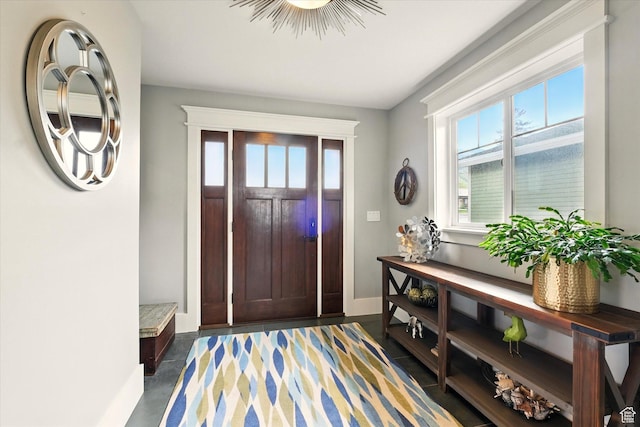 foyer entrance with baseboards