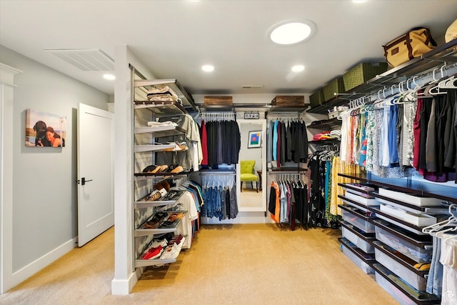 spacious closet featuring carpet flooring