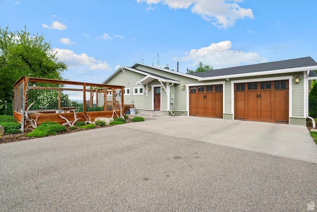 view of front of home featuring a garage and concrete driveway