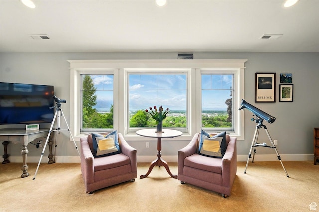 living area with light colored carpet, baseboards, and recessed lighting
