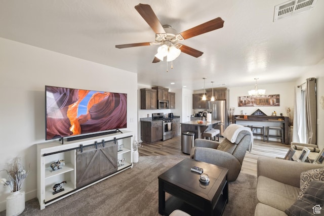 5849 S Firebird Way, St George, UT 84790 - living area with a chandelier, ceiling fan, and wood finished floors