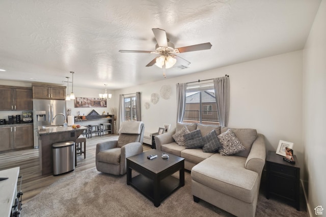5849 S Firebird Way, St George, UT 84790 - living room featuring ceiling fan, a chandelier, and a textured ceiling