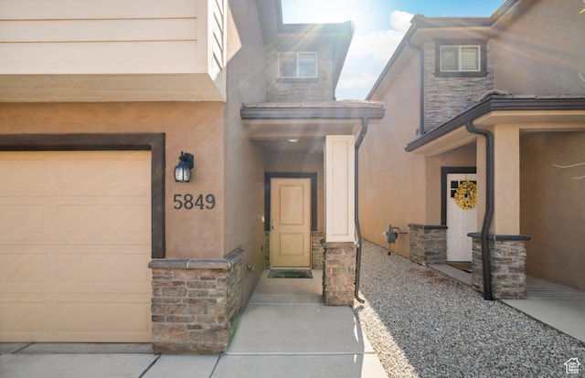 5849 S Firebird Way, St George, UT 84790 - view of exterior entry with stucco siding and stone siding