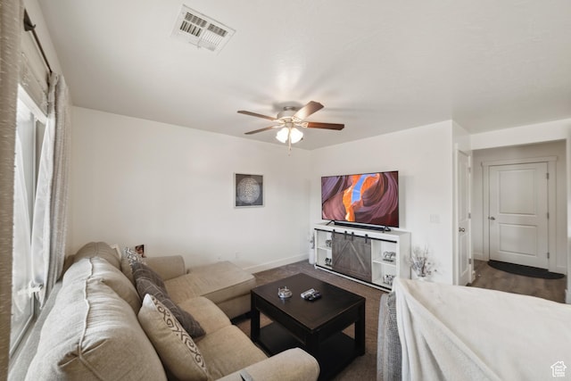 5849 S Firebird Way, St George, UT 84790 - living area featuring a ceiling fan and baseboards