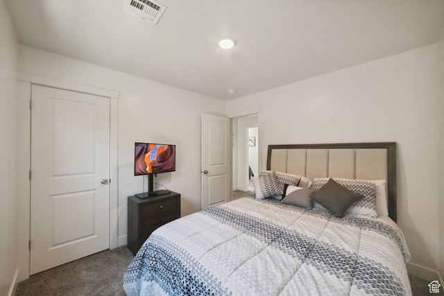 5849 S Firebird Way, St George, UT 84790 - bedroom with dark colored carpet and baseboards