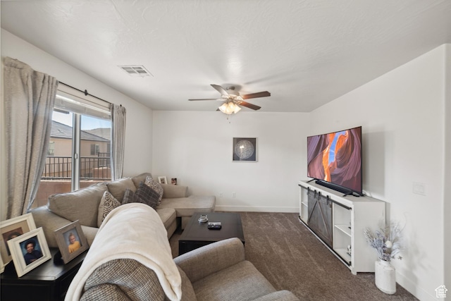 5849 S Firebird Way, St George, UT 84790 - living room featuring ceiling fan, baseboards, and dark carpet