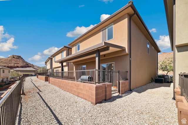 5849 S Firebird Way, St George, UT 84790 - rear view of house with stucco siding and fence