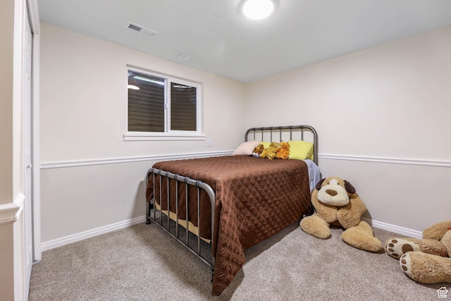 bedroom with carpet and baseboards