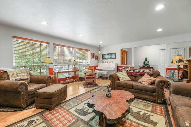 living room featuring recessed lighting and wood finished floors