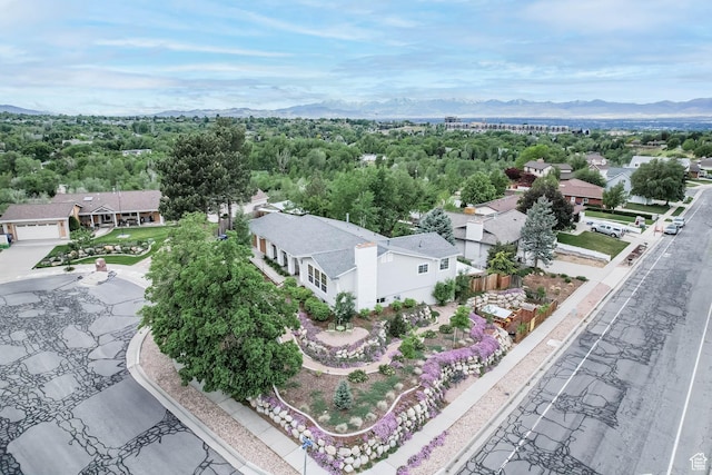 aerial view of residential area featuring mountains