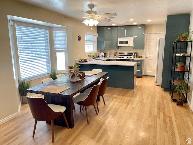 595 N 1200th St E, Lehi, UT 84043 - dining space featuring light wood finished floors, ceiling fan, baseboards, a textured ceiling, and recessed lighting