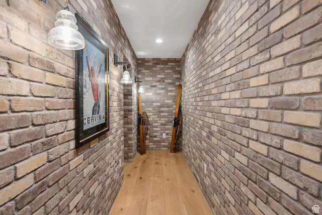 1677 Lambert Ln, Kamas, UT 84036 - hall featuring brick wall and light wood-style floors