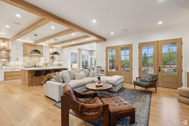 1677 Lambert Ln, Kamas, UT 84036 - living area with french doors, plenty of natural light, light wood-style floors, recessed lighting, and beamed ceiling