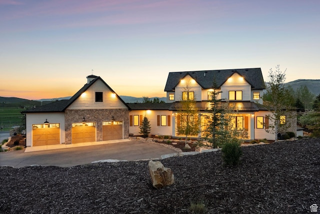 1677 Lambert Ln, Kamas, UT 84036 - view of front of property with concrete driveway, an attached garage, and stone siding