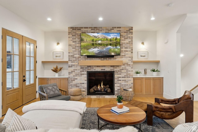 1677 Lambert Ln, Kamas, UT 84036 - living area featuring wood finished floors, french doors, recessed lighting, a fireplace, and built in features