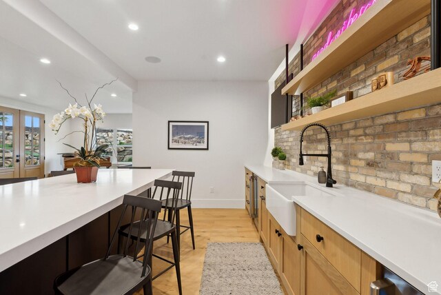 1677 Lambert Ln, Kamas, UT 84036 - kitchen with a sink, light countertops, open shelves, recessed lighting, and a kitchen breakfast bar