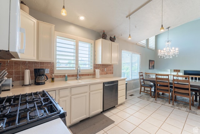 kitchen featuring dishwasher, a sink, white microwave, light tile patterned flooring, and black gas range oven
