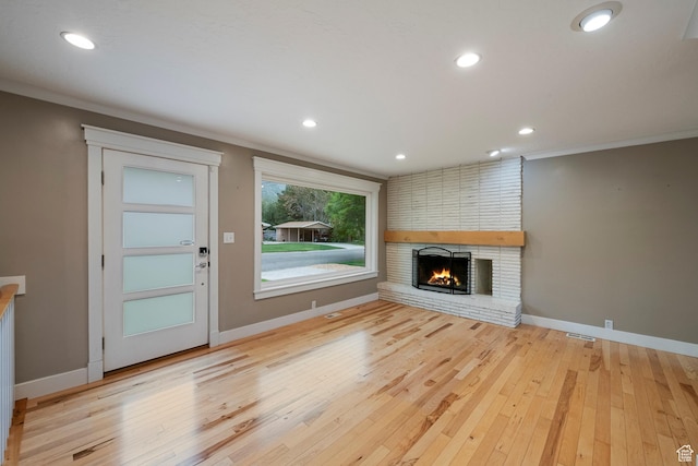 2925 N 220 E, Provo, UT 84604 - unfurnished living room with wood-type flooring, baseboards, a fireplace, ornamental molding, and recessed lighting