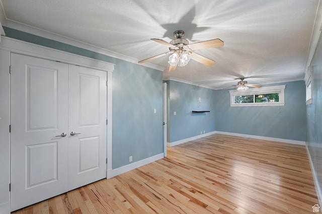 2925 N 220 E, Provo, UT 84604 - unfurnished bedroom featuring ornamental molding, light wood-style floors, baseboards, a closet, and a ceiling fan