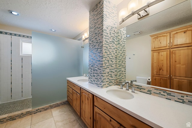 2925 N 220 E, Provo, UT 84604 - bathroom featuring toilet, a textured ceiling, a walk in shower, double vanity, and tile patterned floors