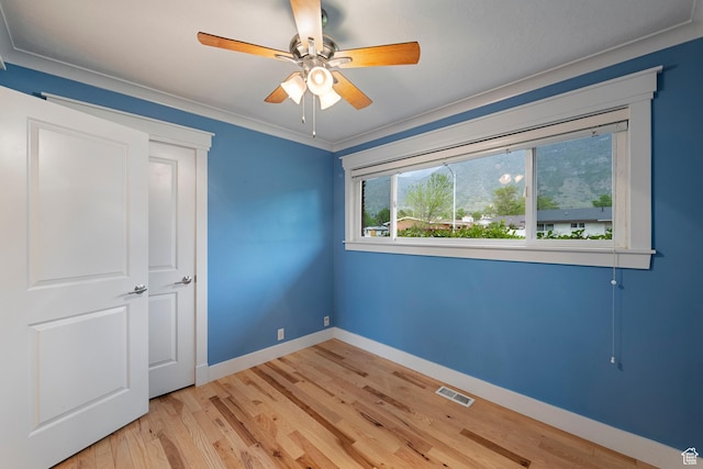 2925 N 220 E, Provo, UT 84604 - unfurnished bedroom featuring baseboards, light wood-style flooring, a ceiling fan, and ornamental molding
