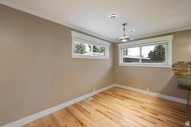 2925 N 220 E, Provo, UT 84604 - empty room featuring baseboards, light wood-style floors, and ornamental molding