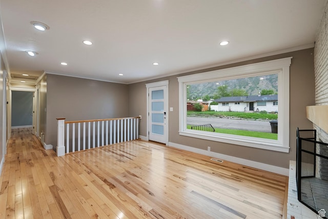 2925 N 220 E, Provo, UT 84604 - empty room featuring ornamental molding, light wood-style floors, baseboards, recessed lighting, and a fireplace