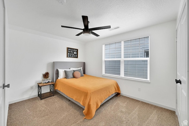 3553 N Willow Creek Ln E, Eden, UT 84310 - carpeted bedroom featuring baseboards, a ceiling fan, and a textured ceiling