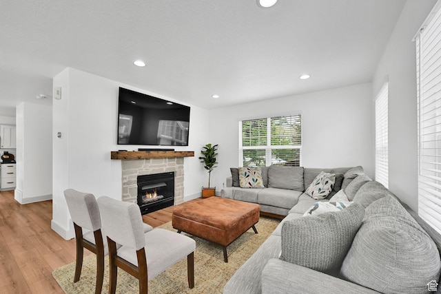 3553 N Willow Creek Ln E, Eden, UT 84310 - living room with light wood-type flooring, recessed lighting, a fireplace, and baseboards