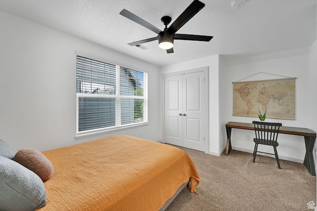 3553 N Willow Creek Ln E, Eden, UT 84310 - bedroom with carpet floors, a closet, a textured ceiling, baseboards, and ceiling fan