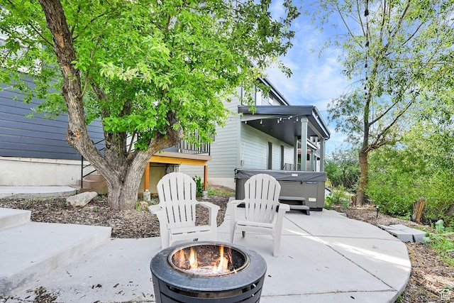 3553 N Willow Creek Ln E, Eden, UT 84310 - view of patio with a fire pit and a hot tub