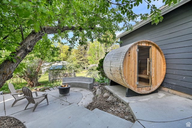 3553 N Willow Creek Ln E, Eden, UT 84310 - view of patio with a fire pit and fence