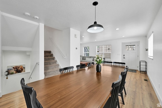 3553 N Willow Creek Ln E, Eden, UT 84310 - dining area with plenty of natural light, light wood-style flooring, stairway, recessed lighting, and a textured ceiling
