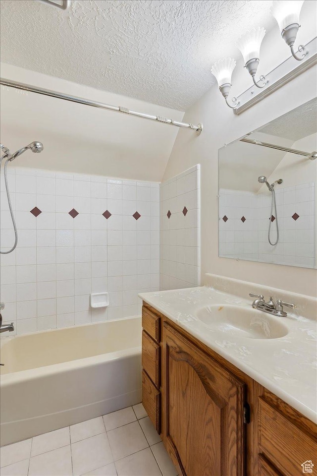 5375 N 3325 E, Eden, UT 84310 - bathroom with tile patterned floors, shower / bathtub combination, a textured ceiling, vaulted ceiling, and vanity