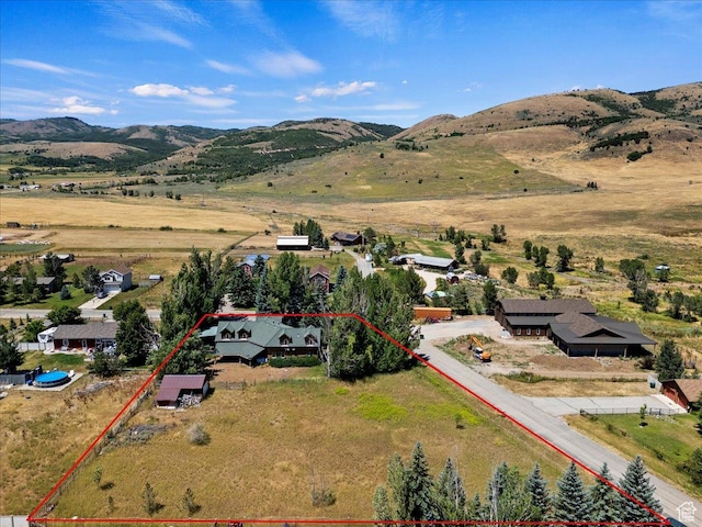 5375 N 3325 E, Eden, UT 84310 - aerial view of property and surrounding area featuring property boundaries highlighted and a mountainous background