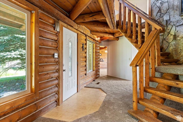 5375 N 3325 E, Eden, UT 84310 - entrance foyer featuring log walls, stairs, plenty of natural light, wooden ceiling, and beam ceiling