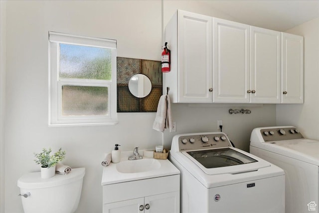 clothes washing area with washer and dryer
