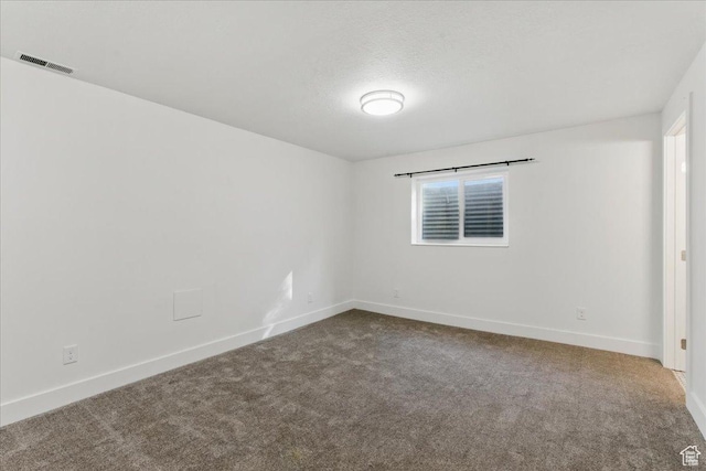 empty room with carpet floors and baseboards