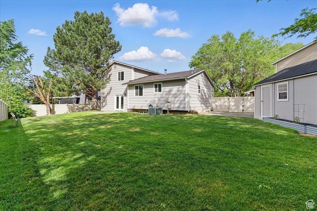 rear view of property featuring central AC and french doors