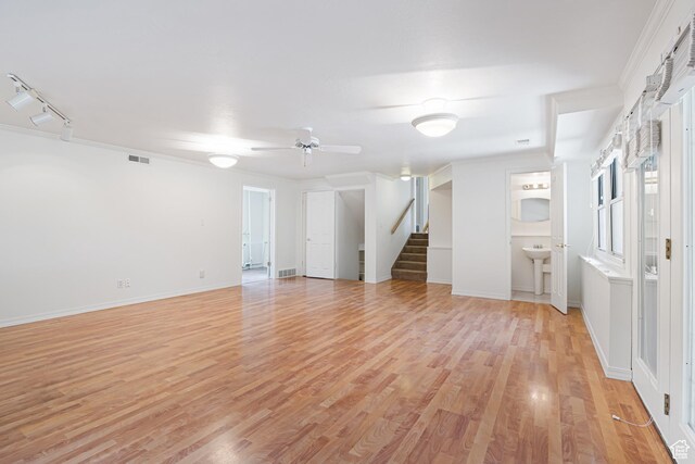 4115 Edgehill Dr, Ogden, UT 84403 - empty room featuring stairs, light wood finished floors, ceiling fan, and baseboards