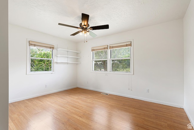 4115 Edgehill Dr, Ogden, UT 84403 - unfurnished room with light wood-style flooring, baseboards, ceiling fan, and a textured ceiling