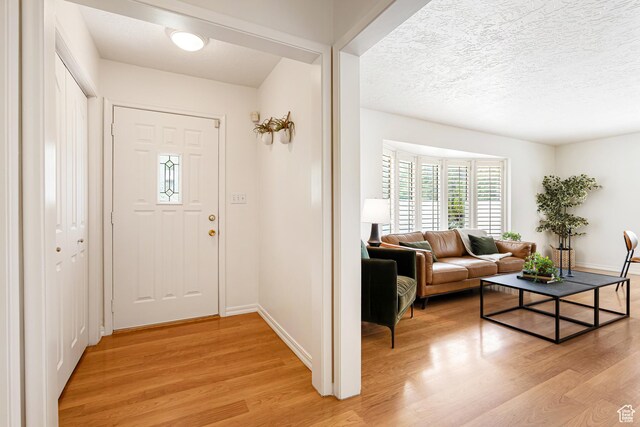 4115 Edgehill Dr, Ogden, UT 84403 - entrance foyer with light wood-type flooring and baseboards