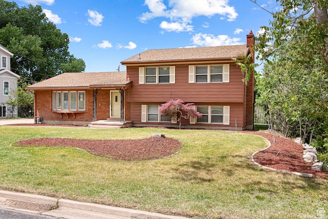 4115 Edgehill Dr, Ogden, UT 84403 - split level home with a chimney