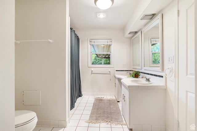 4115 Edgehill Dr, Ogden, UT 84403 - full bathroom with toilet, tile patterned floors, vanity, baseboards, and a shower with curtain