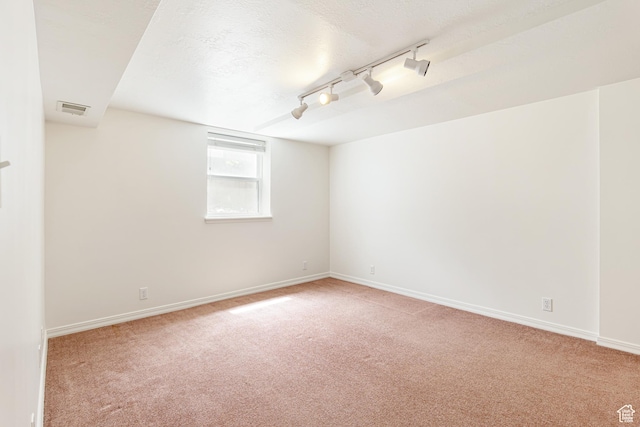 4115 Edgehill Dr, Ogden, UT 84403 - spare room featuring light carpet, a textured ceiling, baseboards, and track lighting