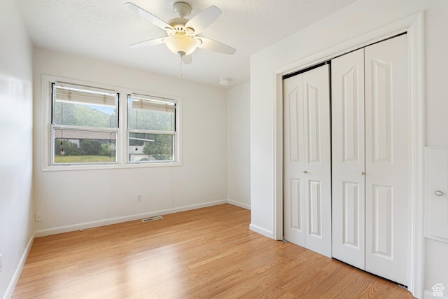 4115 Edgehill Dr, Ogden, UT 84403 - unfurnished bedroom with light wood finished floors, a closet, baseboards, and a ceiling fan